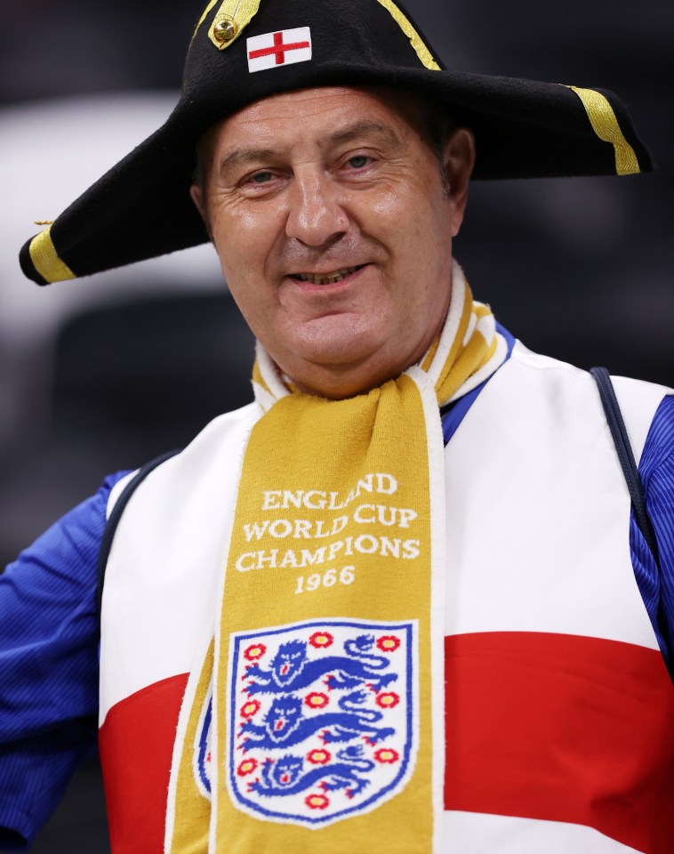 An England fan enjoys the pre match atmosphere at Al Bayt Stadium