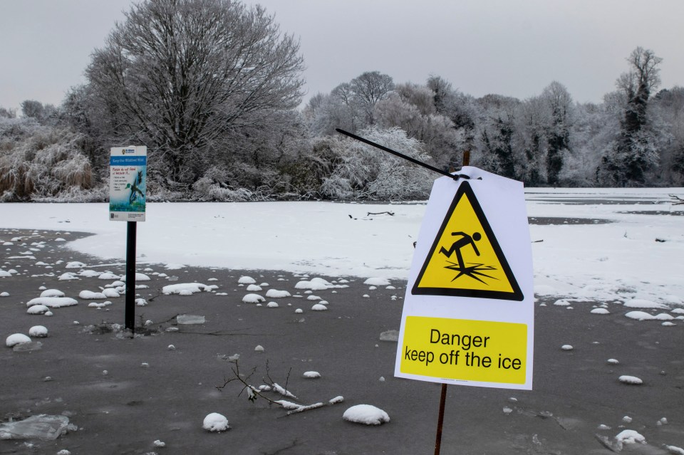 A sign warning people to keep off the ice at Verulamium Park Lake, St Albans, Herts., following the tragic death of three youngsters