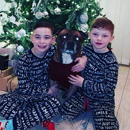 Jaeden, 10 and Ollie, 7 with Buddy. Just weeks before the festivities were set to begin, Joely Eaton had to break the news their dog needed his leg amputated