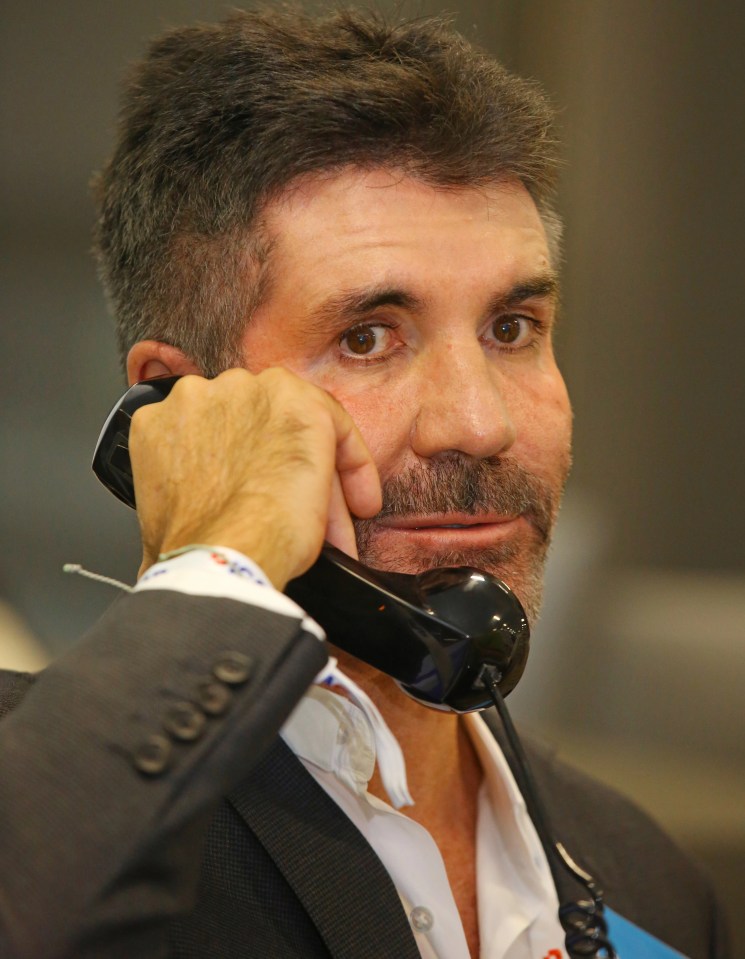 Simon Cowell hit the phones at the annual ICAP Charity Day in London