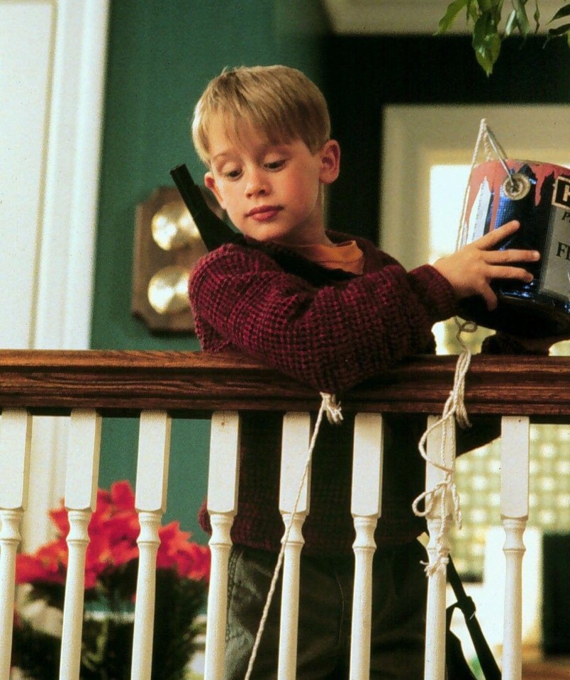 Kevin throws a paint can at Harry in Home Alone