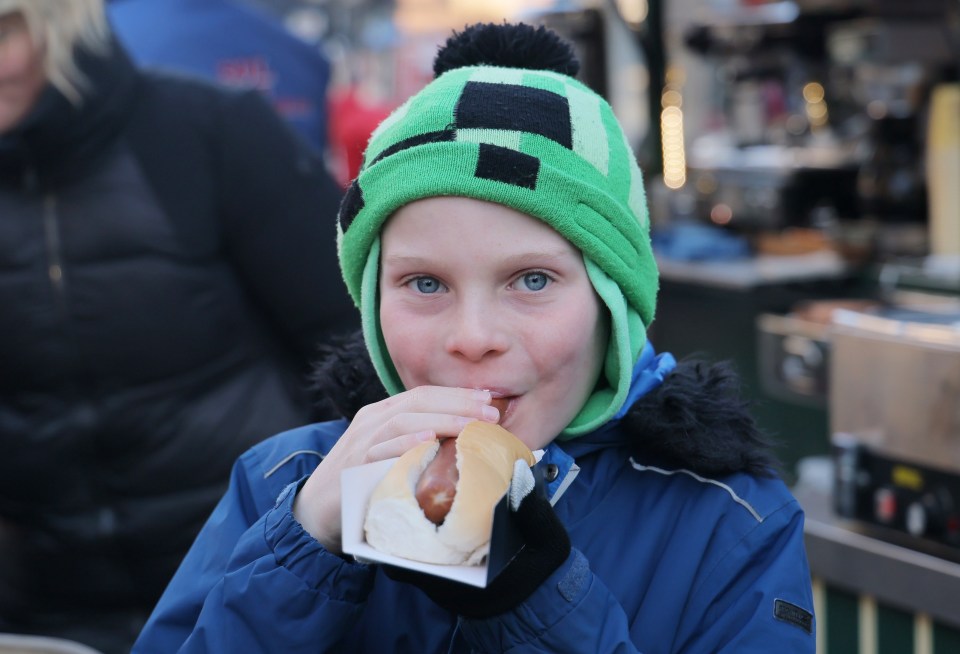 Mason's mum treated him to a hot dog at the Durham market and said it's 'good to see that prices are still low in places'