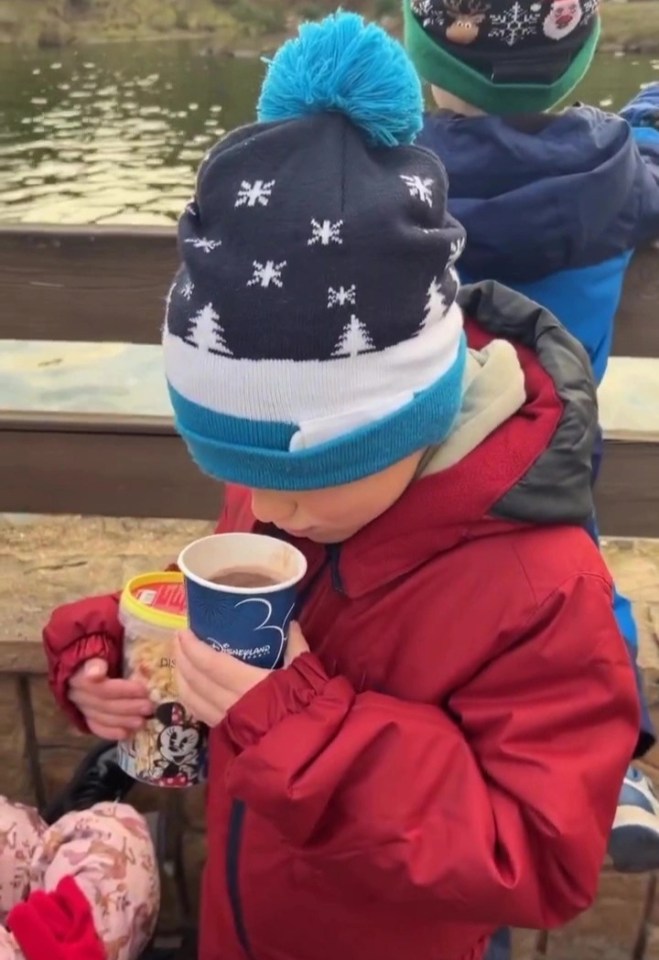 Casper enjoying hot chocolate in Disneyland Paris