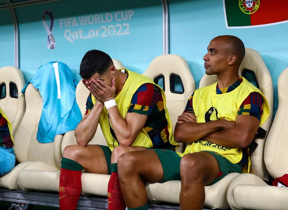 Cristiano Ronaldo holds his head in his hands after being dropped to the bench for Portugal against Switzerland