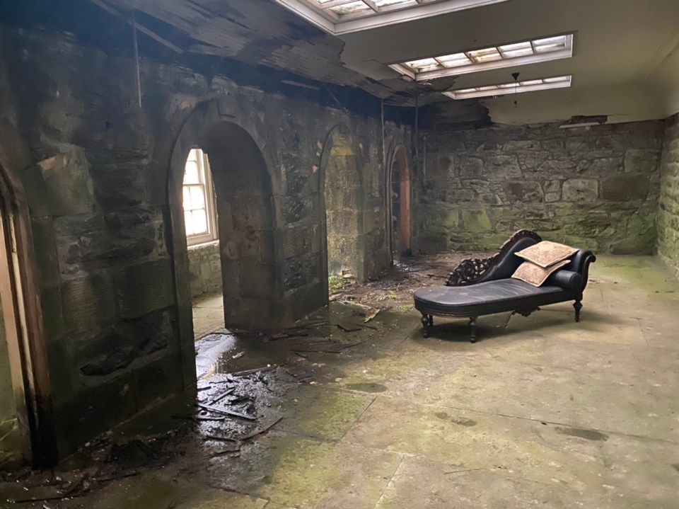 Images show an abandoned chaise longue in a damp corridor