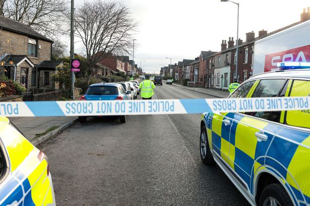 Police at the scene in Bury, Greater Manchester, after the collision