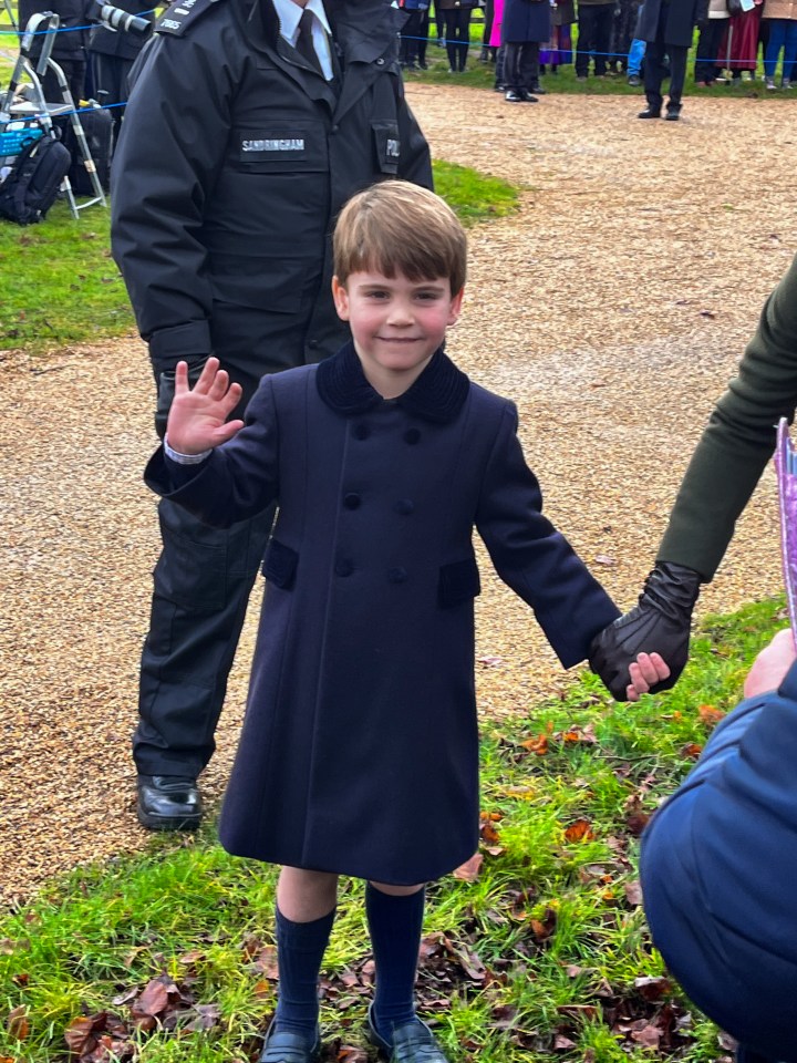 Prince Louis waved as he walked with his parents to St Mary Magdalene Church