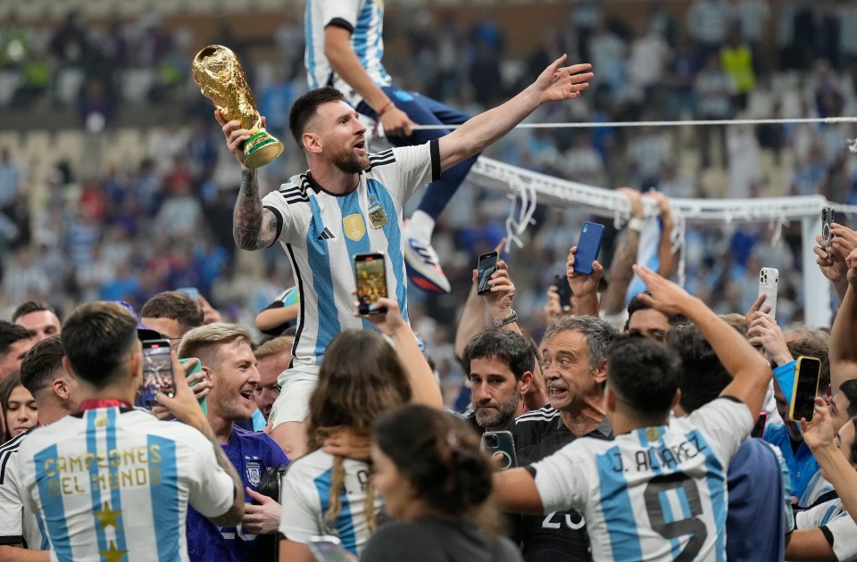 Lionel Messi finally got his hands on the World Cup trophy on Sunday