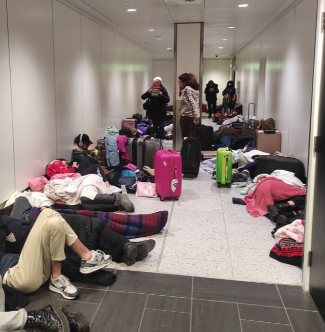 Emirates flight passengers at Gatwick Airport were found sleeping in the corridors on Monday morning after flights were cancelled due to snow