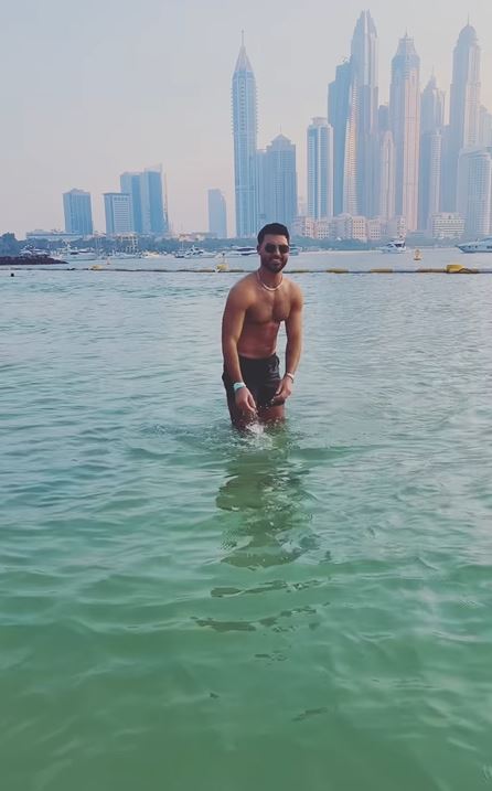 The TV star posed for the camera as he took a dip in the ocean