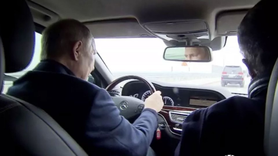 Vladimir Putin got behind the wheel to drive over the destroyed Crimean bridge