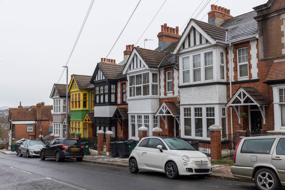 The terraced home stands out among the row of more traditional-looking houses