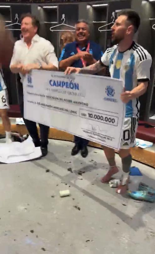 Lionel Messi dances with a $10m cheque