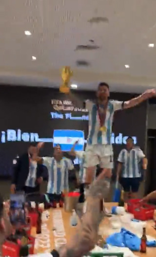 Lionel Messi danced on a table clutching the World Cup