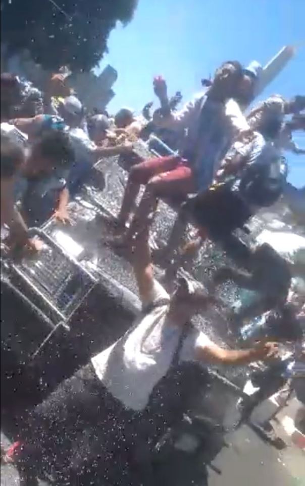 Fans danced on top of the abandoned police car