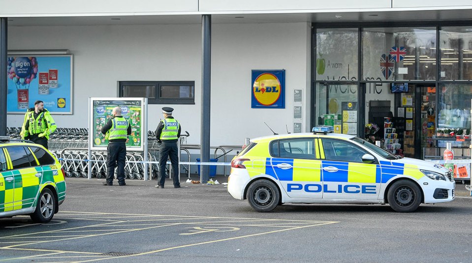 A Lidl supermarket has been shut down and surrounded by cops who made an arrest after a "disturbance"