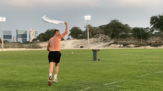 The Man Utd legend then pulled off his shirt before jumping over a wheelie bin