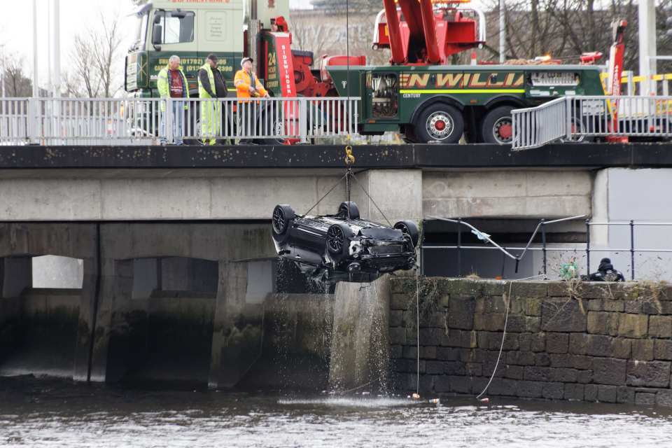 The black BMW being lifted from the River Tawe