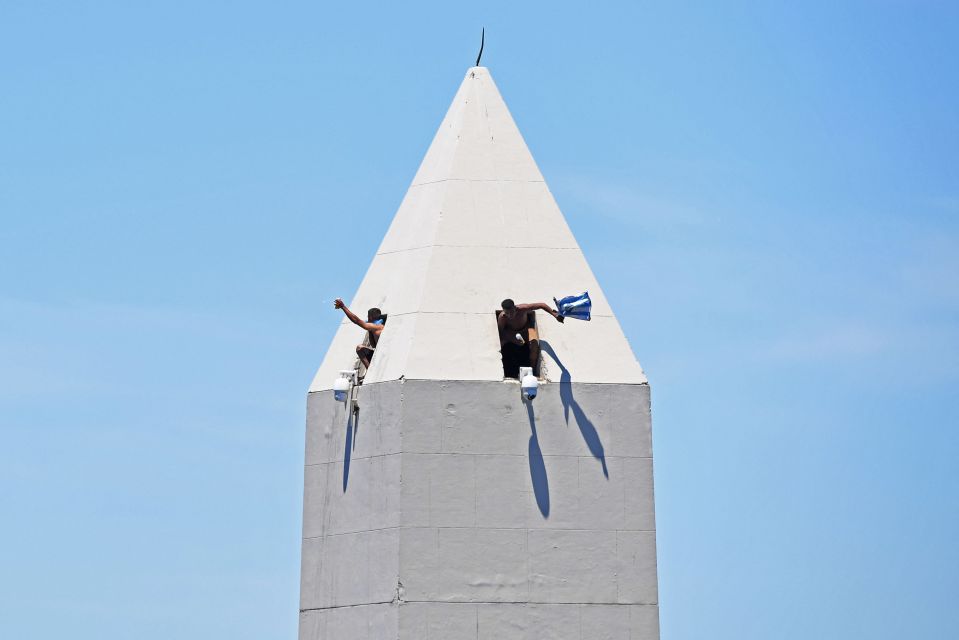 People were even hanging out of the Obelisk monument