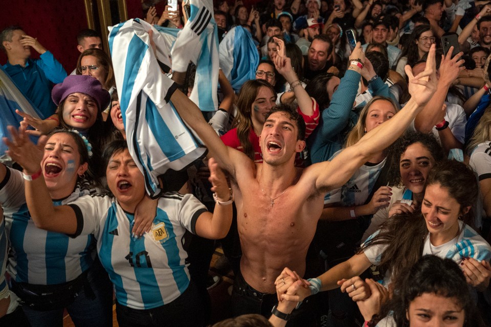 Argentina fans celebrate in a bar in Madrid, Spain