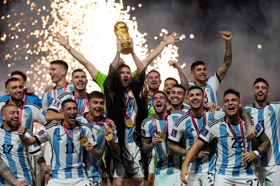 Lionel Messi lifts the World Cup trophy