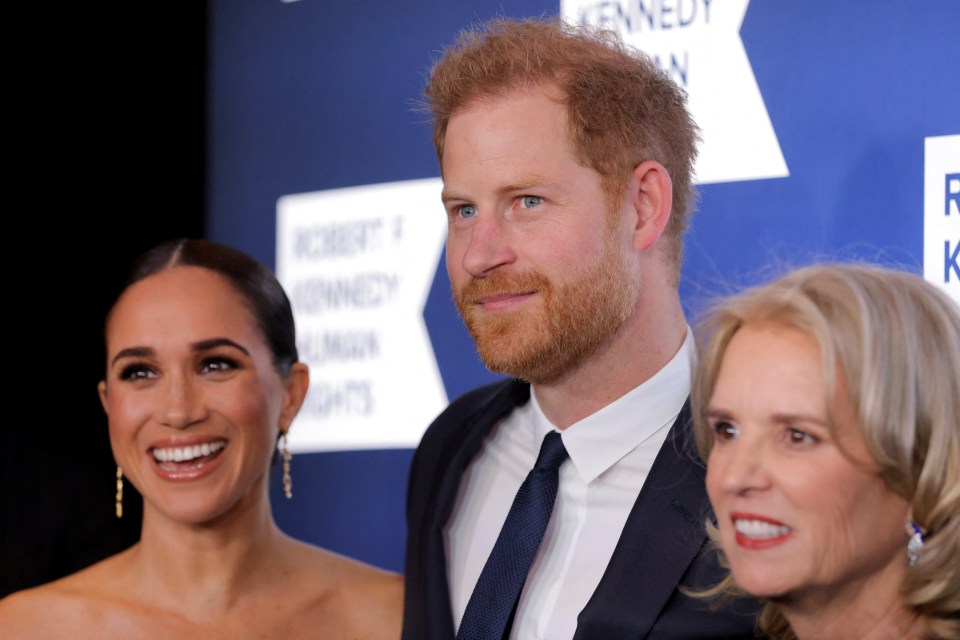 The couple pictured with Kerry Kennedy, the niece of John F. Kennedy