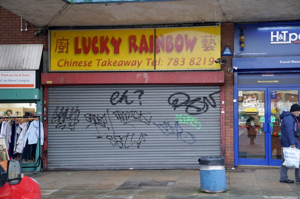 Graffiti on shutters in the centre of Hodge Hill