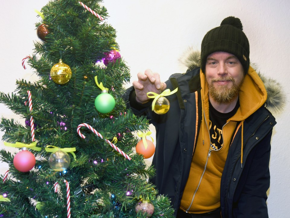 Dale Wells with the Body Fluid Baubles on the Christmas Tree