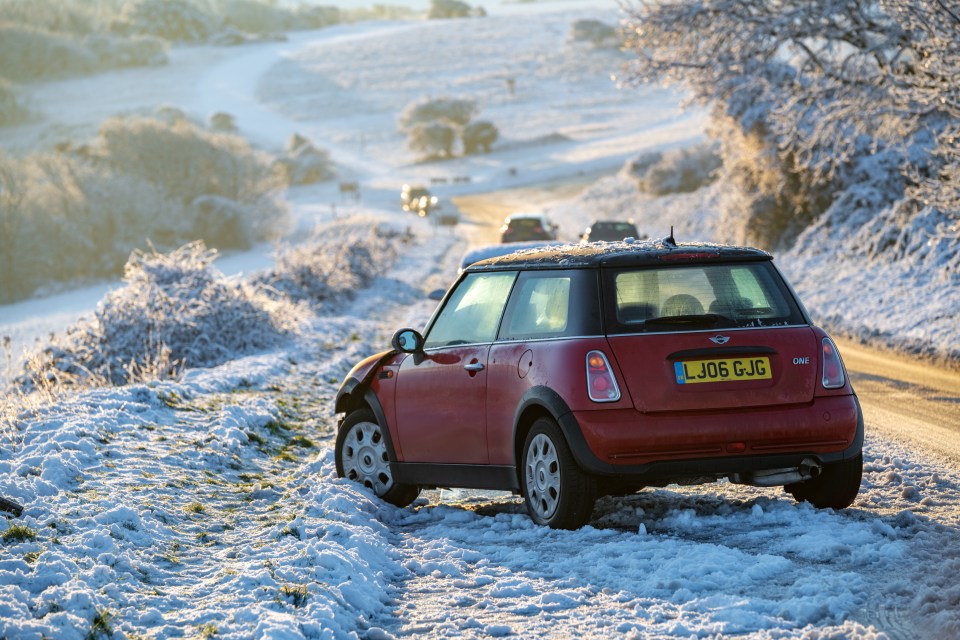 A damaged car with used airbags is left abandoned above Eastbourne near Beachy Head, East Sussex, on Monday morning