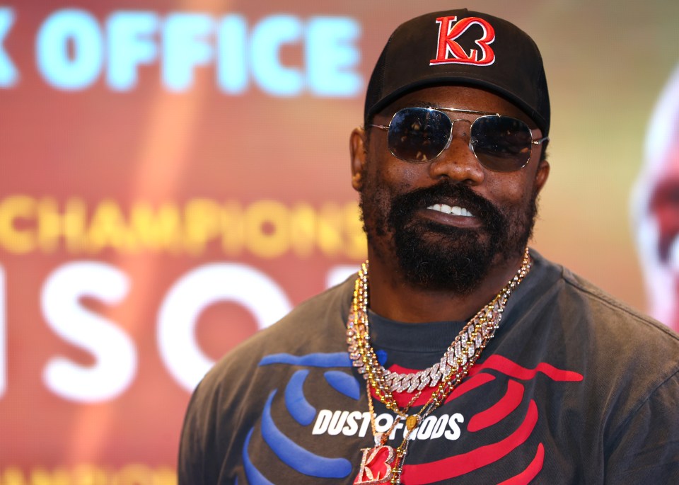 Derek Chisora poses after the press conference