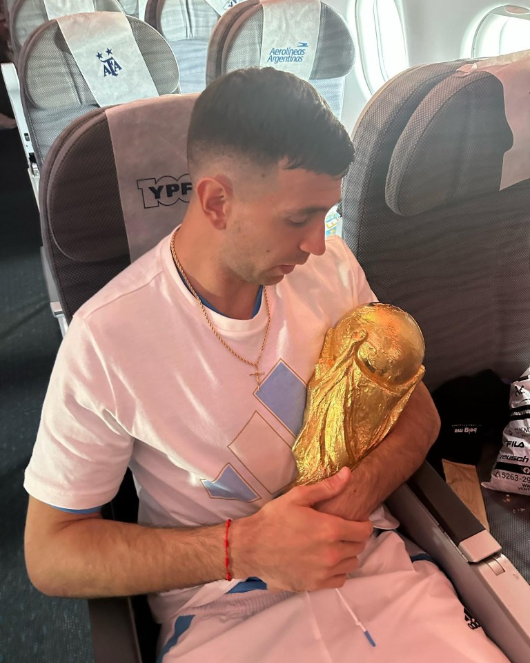 The former Arsenal keeper looked loving at the trophy as he cradled it