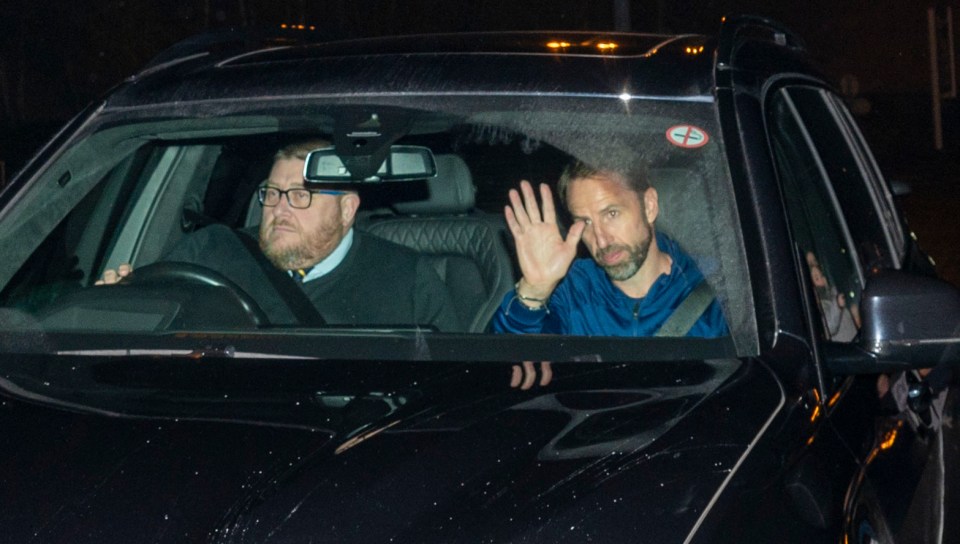 Gareth Southgate waves to the cameras as he heads home from the World Cup