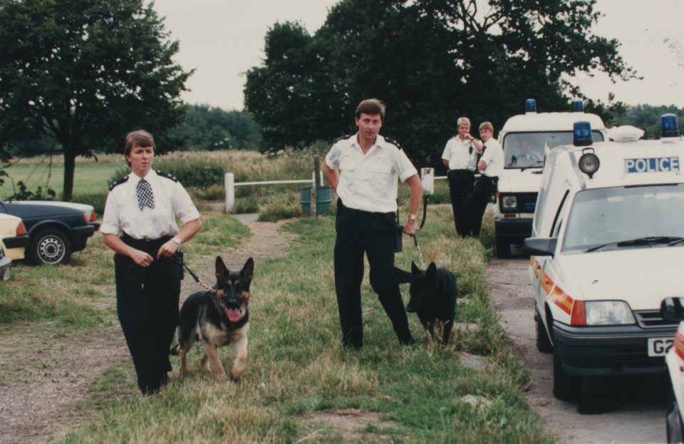 Cops search the crime scene at Wimbledon Common in south-west London