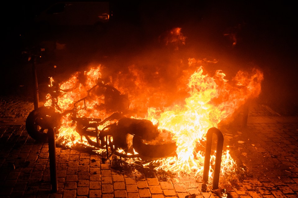 Motorbikes and cars in Paris were set alight by crazed football fans last week