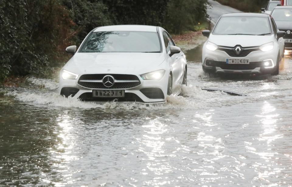 Flooding on a road in Essex after heavy rain and thawing snow