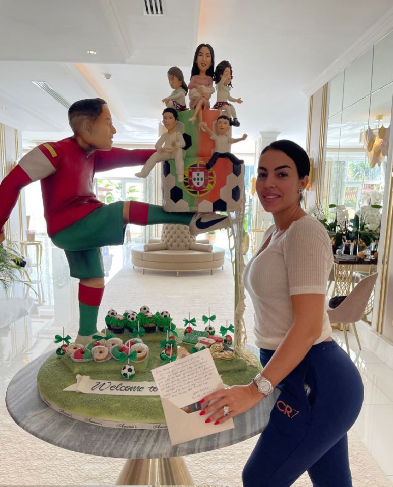 She was greeted with a huge cake of Ronaldo and the family upon arrival at her Qatar hotel