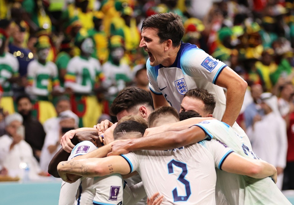 England players celebrate after scoring against Senegal