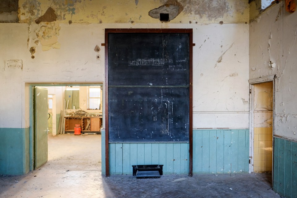 A school is up for sale with decades-old maths lessons still on the blackboards