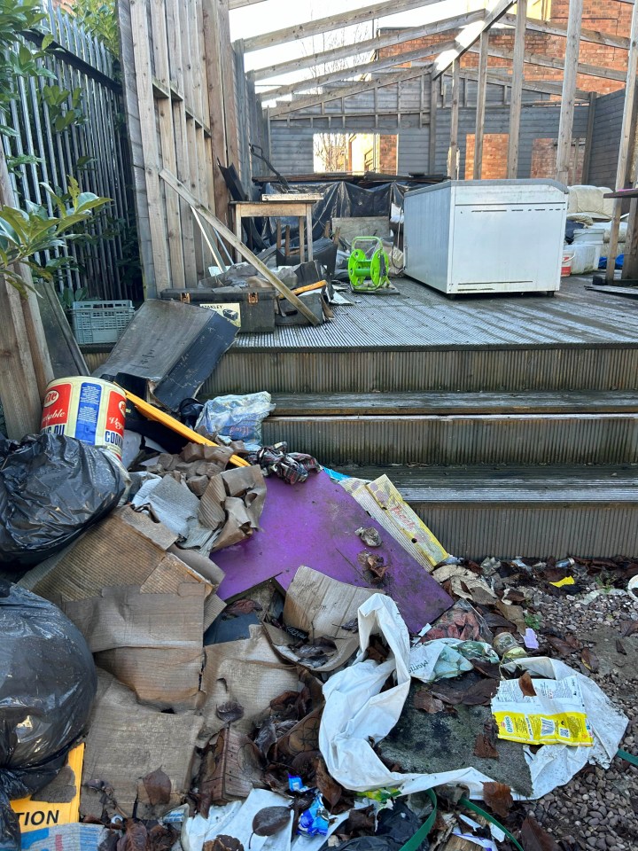 Rubbish piled high on an abandoned decking area