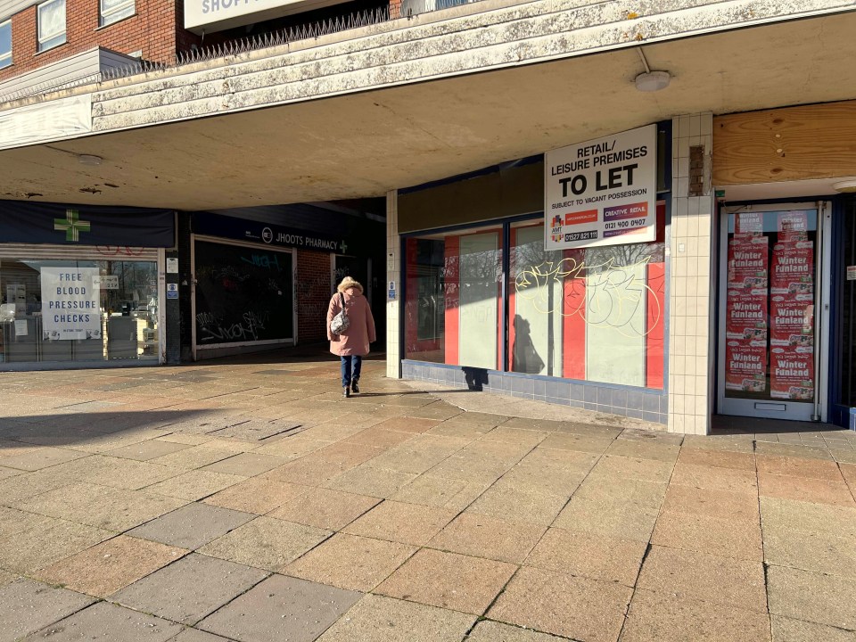 Many of the shops lie empty and are covered in graffiti