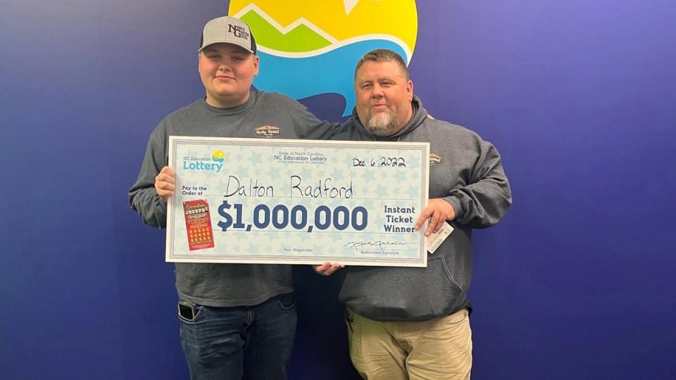 Dalton Radford and his dad Tim after scooping his $1 million prize