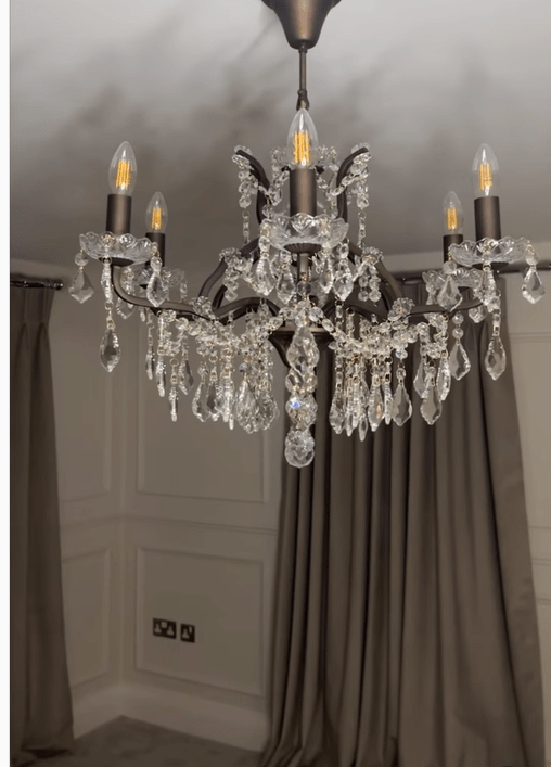 The room features a huge chandelier