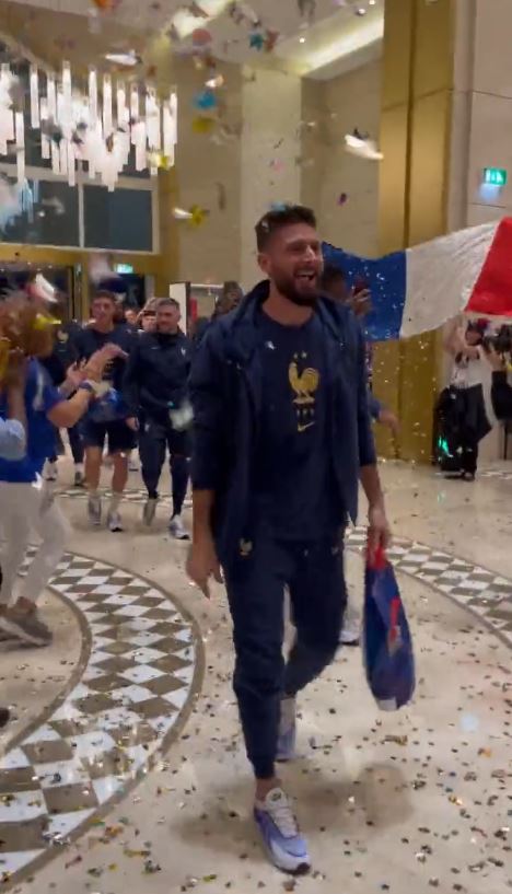 Matchwinner Olivier Giroud high-fived people on his way in