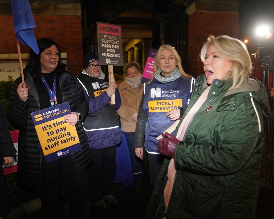 Royal College of Nursing (RCN) General Secretary Pat Cullen, right, joins members of the RCN on the picket line outside the Royal Victoria Infirmary, Newcastle this morning