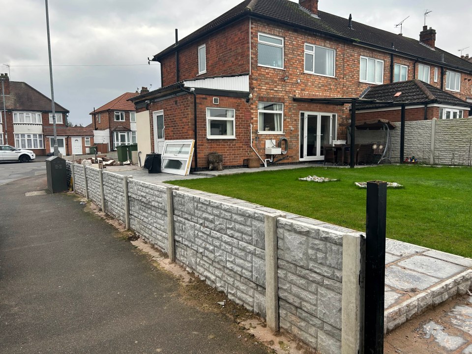 The family have now had to tear down the extension and halve the height of the wall