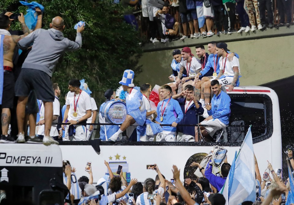 Crazy scenes in Buenos Aires as the squad get on open top bus from the airport