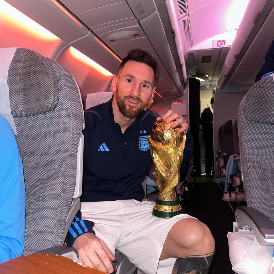 Messi posed with the Jules Rimet on Argentina's flight back to Buenos Aires