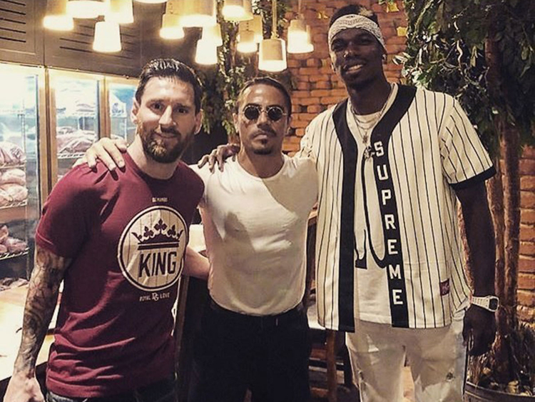 Salt Bae poses with beaming Lionel Messi and Paul Pogba at his Dubai restaurant in 2018