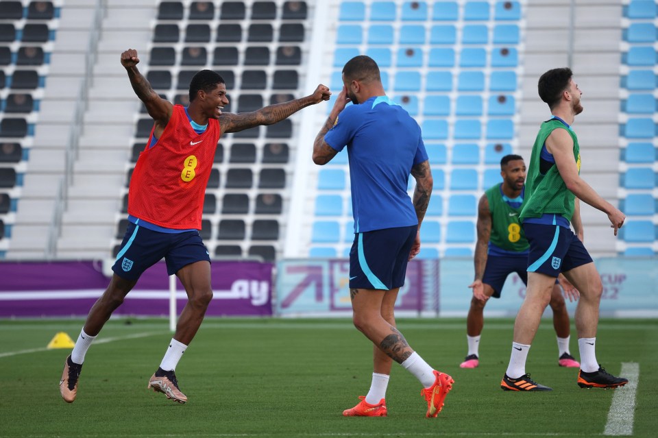 Marcus Rashford celebrates during practice at the Al Wakrah Stadium