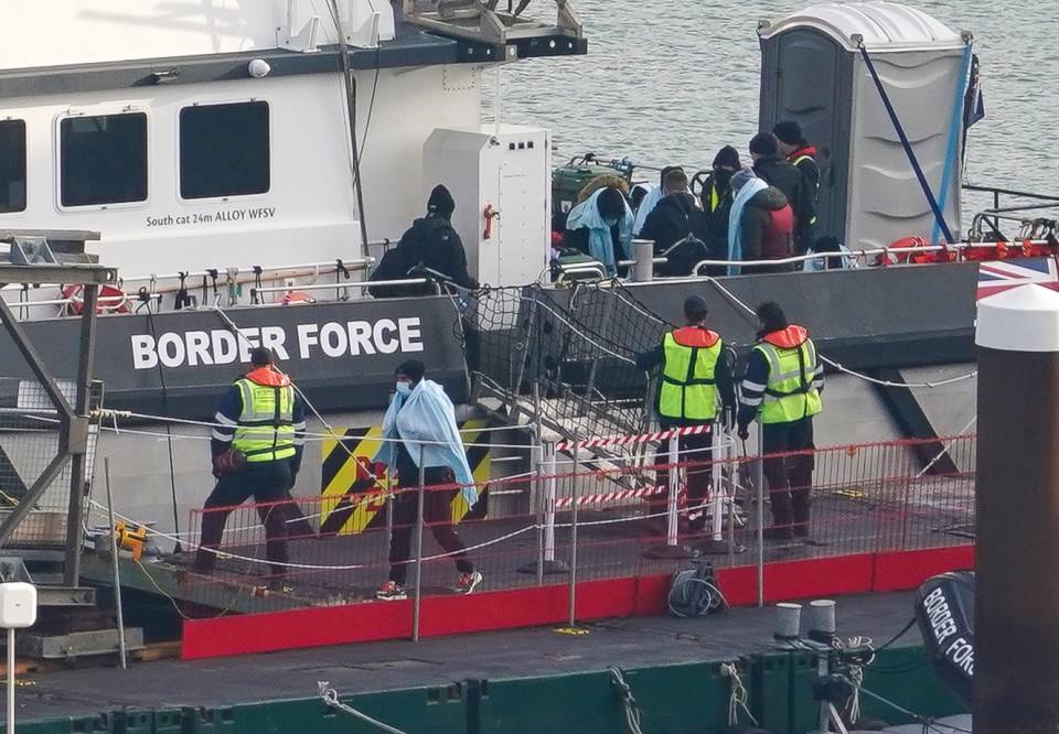 The group clamoured on the small boat in freezing temperatures before it capsized